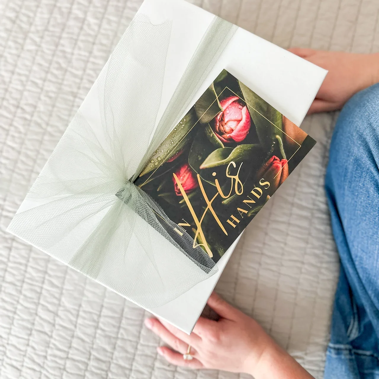 in his hands card / gift overhead photo